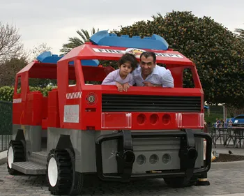 Dr. Shirzadnia riding in a truck with his daughter