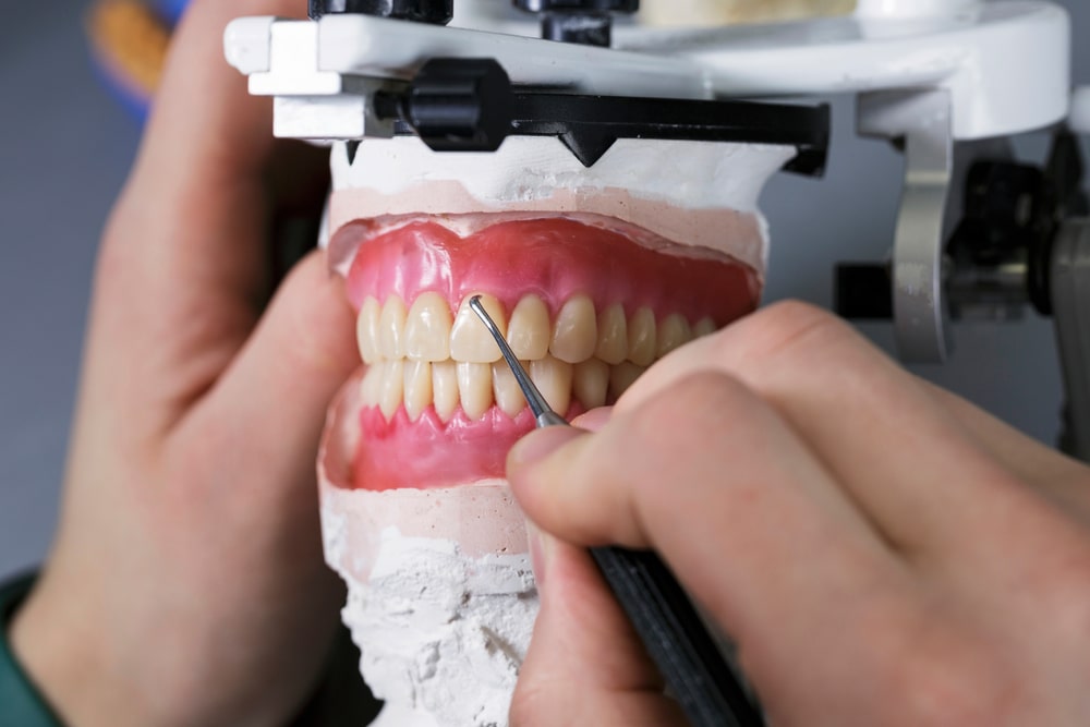 technician work on on removable dental prostheses