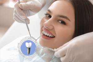 young woman implanted teeth visiting dentist